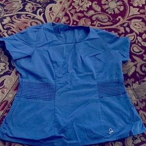 Jaanuu Royal Blue Scrub top. Gold zipper on left side .